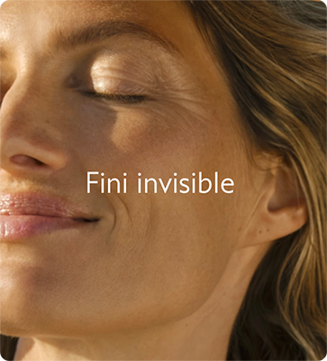 Close-up of a woman with closed eyes, smiling softly in sunlight. The words "Fini invisible" are superimposed on the image.