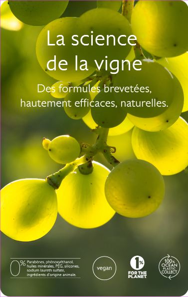 Backlit close-up of green grapes overlaid with French text La science de la vigne and icons denoting natural, vegan and eco-friendly claims.